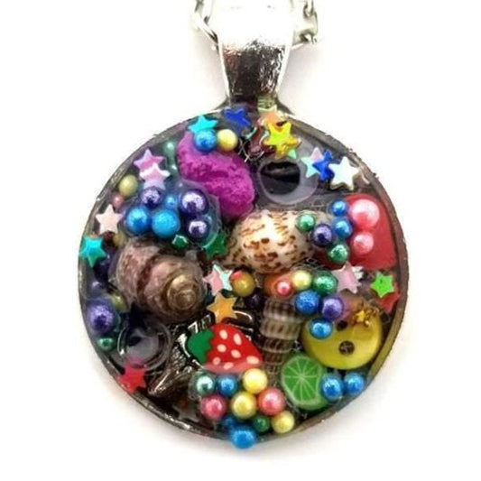 Resin pendant containing variety of unique found objects - Includes 18" chain - Curio Memento