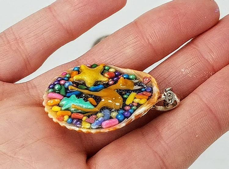 Deer and seashell pendant created using tiny plastic deer, candy sprinkles, sequins and glittered resin - Includes chain - Curio Memento