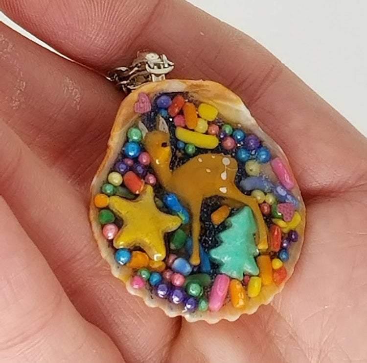 Deer and seashell pendant created using tiny plastic deer, candy sprinkles, sequins and glittered resin - Includes chain - Curio Memento