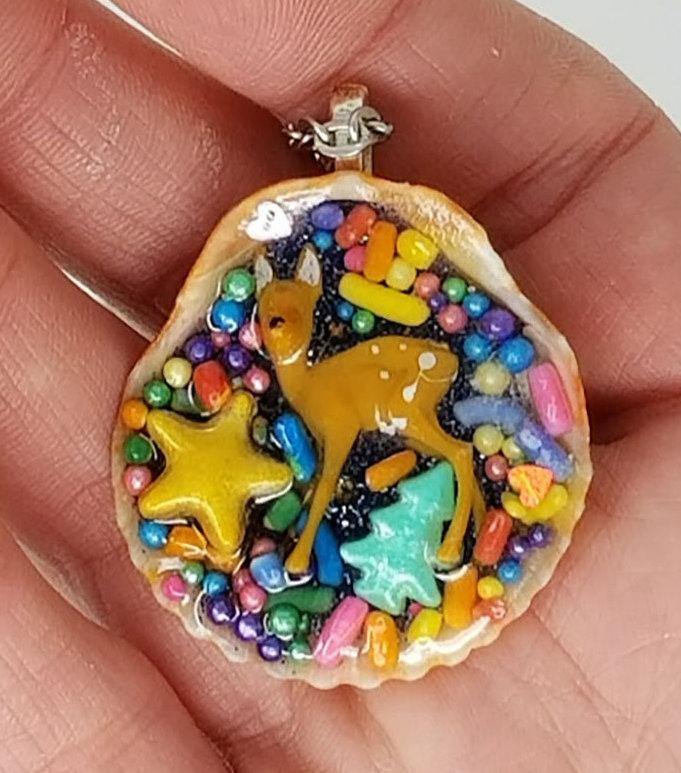 Deer and seashell pendant created using tiny plastic deer, candy sprinkles, sequins and glittered resin - Includes chain - Curio Memento