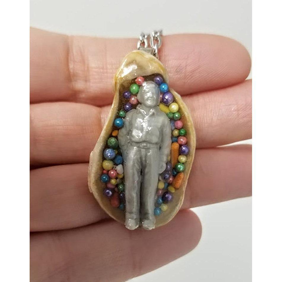 Seashell pendant with miniature human figure and candy sprinkles in layered resin // Includes 18" chain - Curio Memento