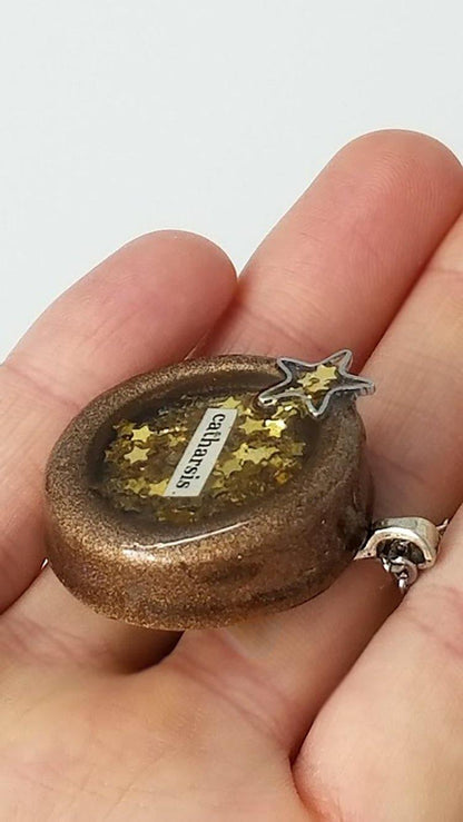 Round painted clay "catharsis" pendant filled with gold star sequins immersed in resin - Includes chain - Curio Memento