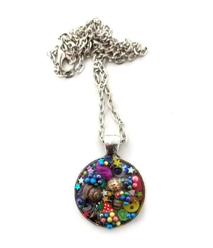 Resin pendant containing variety of unique found objects - Includes 18" chain - Curio Memento