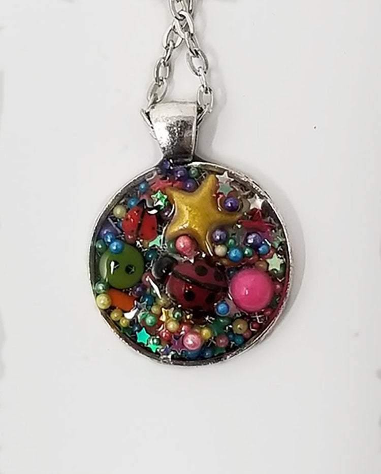 Resin pendant containing variety of unique found objects - chain included - Curio Memento