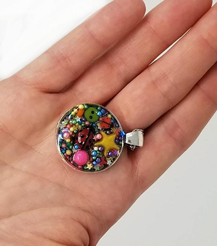 Resin pendant containing variety of unique found objects - chain included - Curio Memento