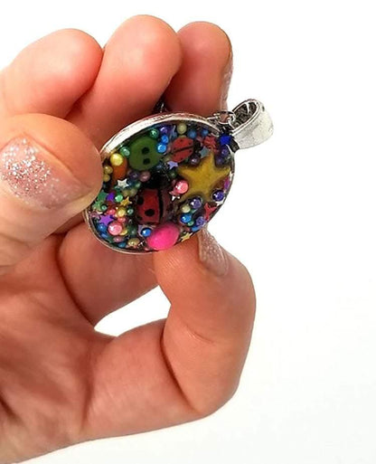 Resin pendant containing variety of unique found objects - chain included - Curio Memento