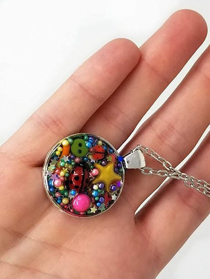 Resin pendant containing variety of unique found objects - chain included - Curio Memento