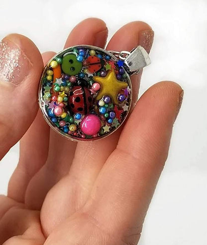 Resin pendant containing variety of unique found objects - chain included - Curio Memento