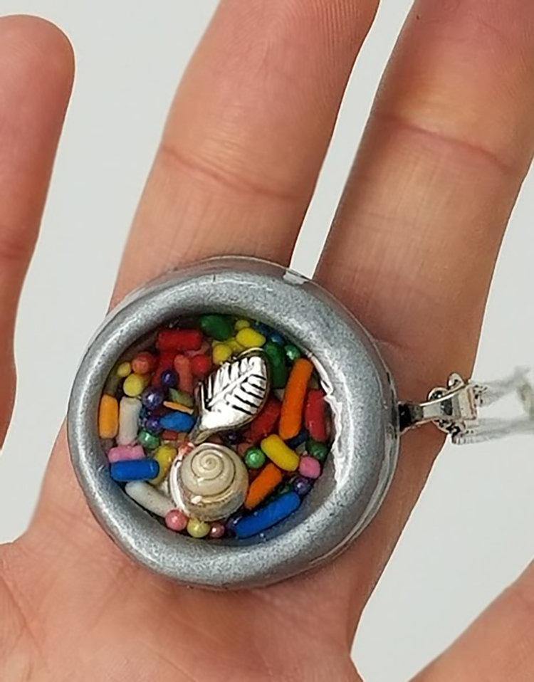 Round gray clay pendant filled with real candy sprinkles, metal leaf and tiny seashell immersed in resin - Includes chain - Curio Memento