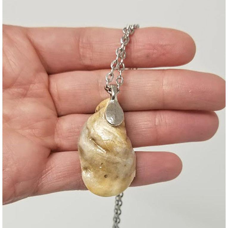 Seashell pendant with miniature human figure and candy sprinkles in layered resin // Includes 18" chain - Curio Memento