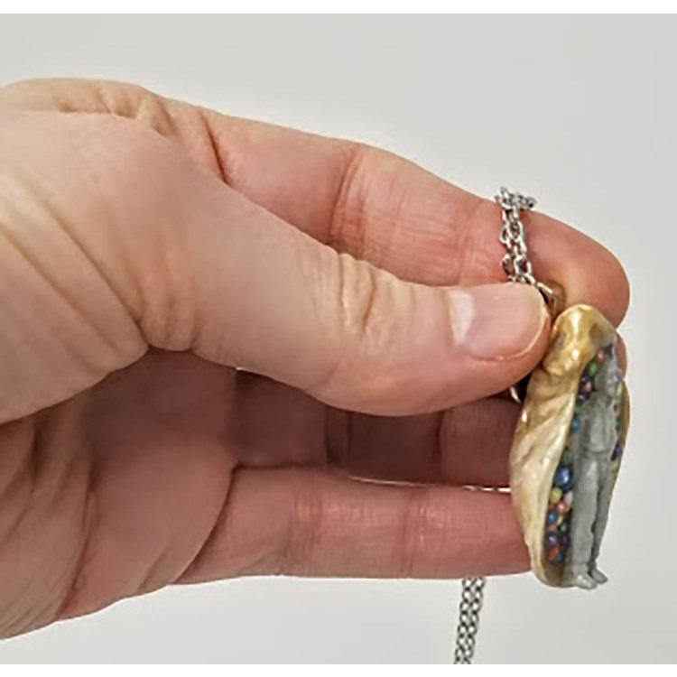 Seashell pendant with miniature human figure and candy sprinkles in layered resin // Includes 18" chain - Curio Memento