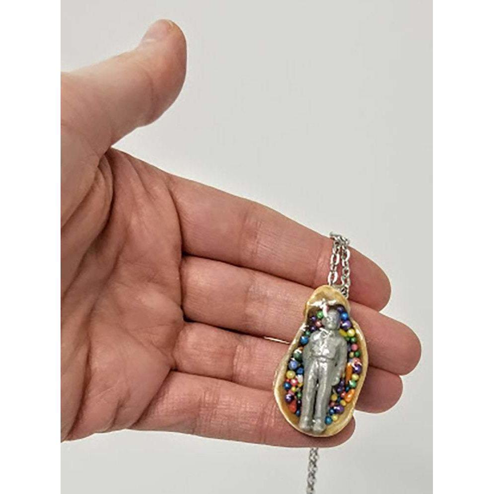 Seashell pendant with miniature human figure and candy sprinkles in layered resin // Includes 18" chain - Curio Memento