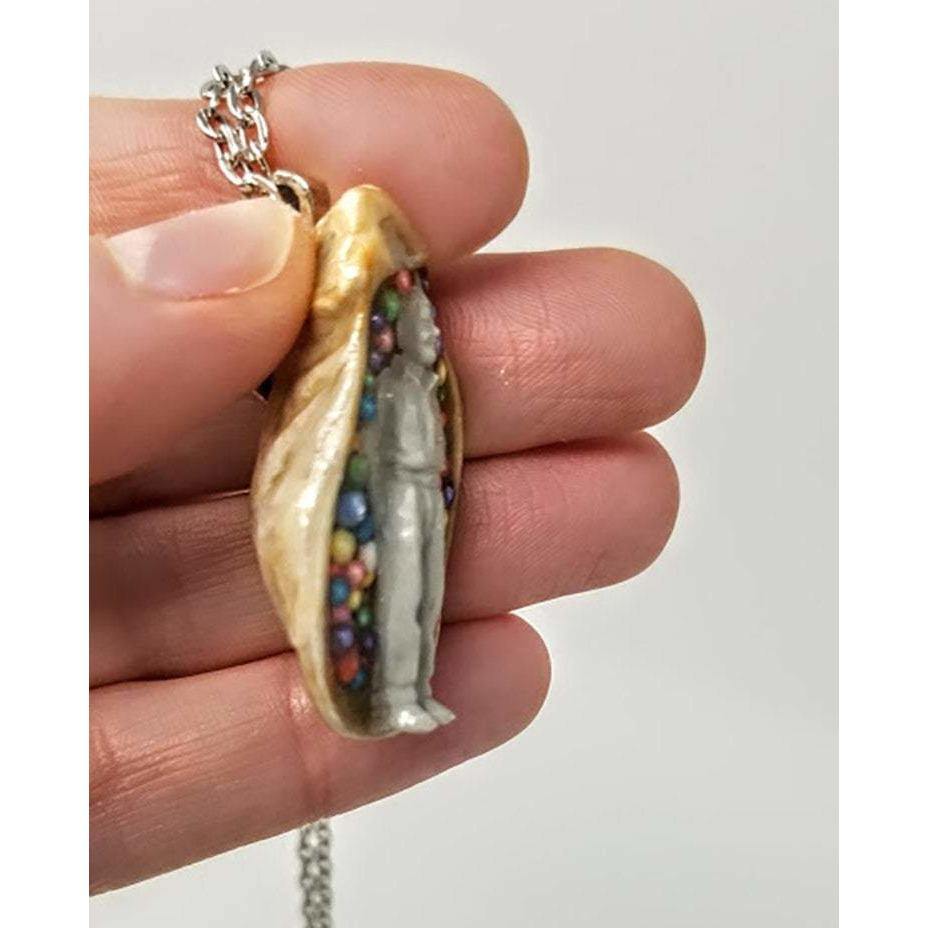 Seashell pendant with miniature human figure and candy sprinkles in layered resin // Includes 18" chain - Curio Memento