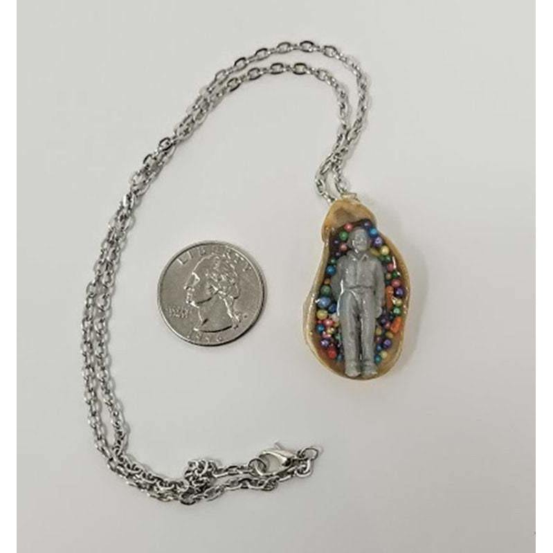 Seashell pendant with miniature human figure and candy sprinkles in layered resin // Includes 18" chain - Curio Memento