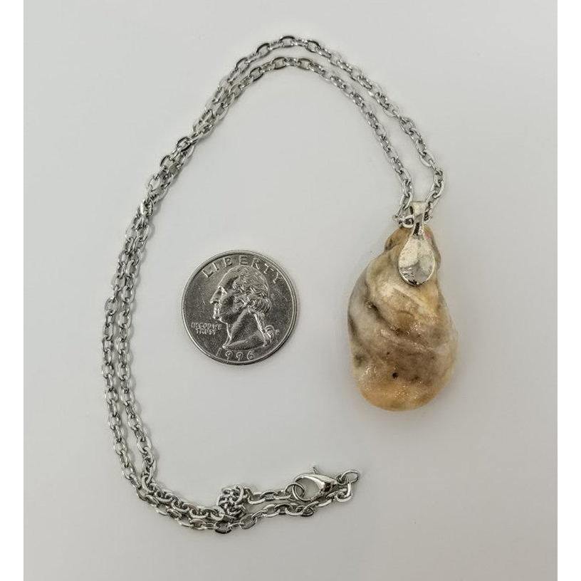 Seashell pendant with miniature human figure and candy sprinkles in layered resin // Includes 18" chain - Curio Memento