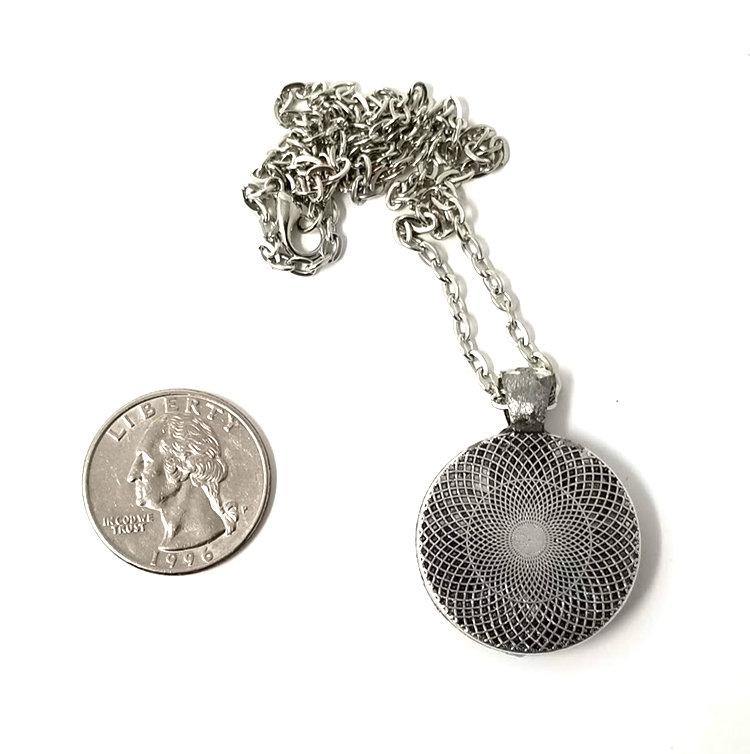 Resin pendant containing variety of unique found objects - Includes 18" chain - Curio Memento